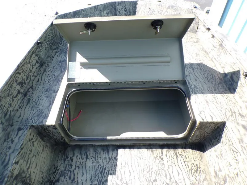 Slide: The Image of Open storage compartment of 2025 Tracker Grizzly® 1650 T Prairie Wings Edition boat. - 9
