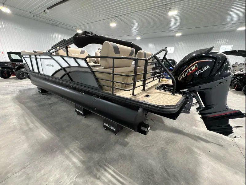 Slide: The Image of 2024 Sylvan L3 RLZ pontoon boat with Yamaha engine in a showroom. - 6
