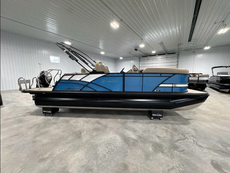 Slide: The Image of 2024 Sylvan Mirage X X3 CLZ DH pontoon boat in a showroom. - 12