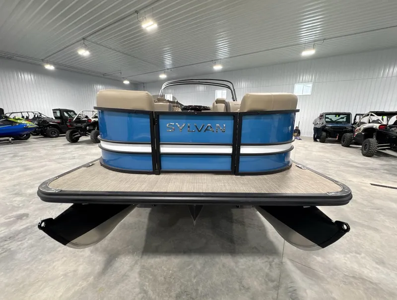 Slide: The Image of 2024 Sylvan Mirage X X3 CLZ DH pontoon boat in a showroom. - 2