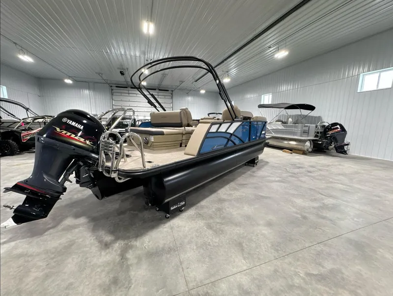 Slide: The Image of 2024 Sylvan Mirage X X3 CLZ DH pontoon boat in a showroom. - 4