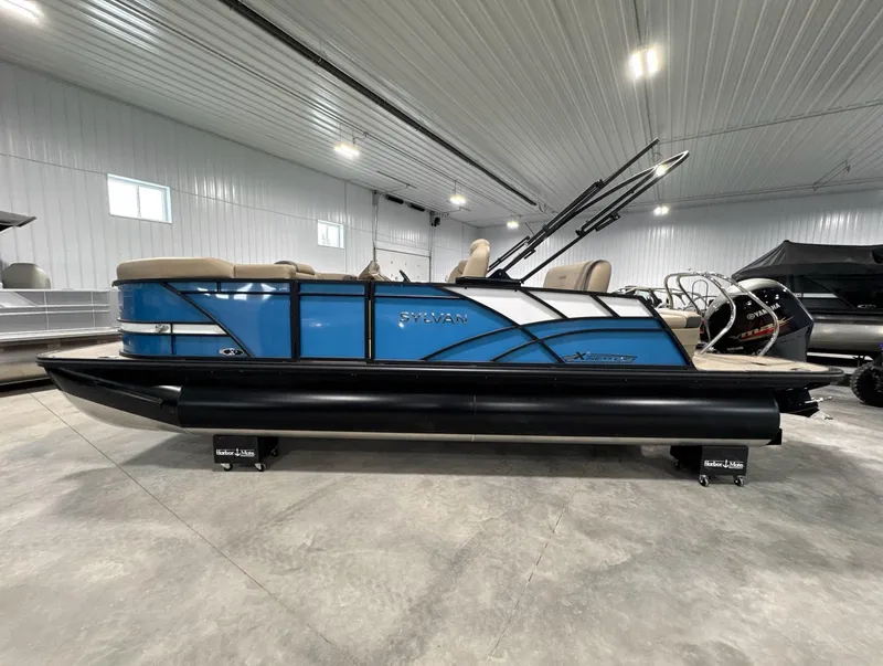 Slide: The Image of 2024 Sylvan Mirage X X3 CLZ DH pontoon boat in a showroom setting. - 7