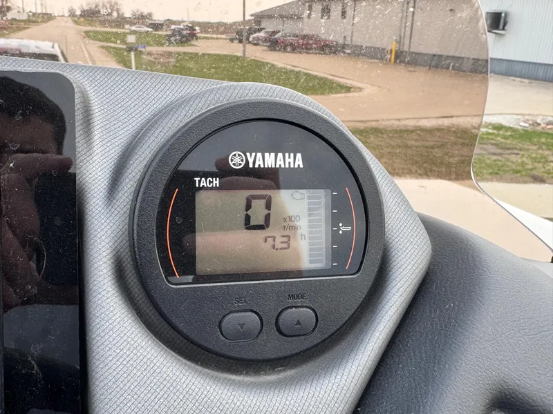 Slide: The Image of Yamaha tachometer on 2023 Sylvan L5 DLZ Bar boat dashboard, displaying zero RPM. - 1
