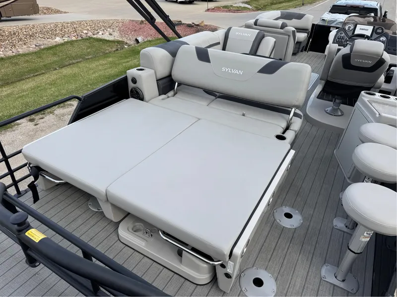 Slide: The Image of 2023 Sylvan L5 DLZ Bar pontoon boat with spacious seating and modern design. - 12