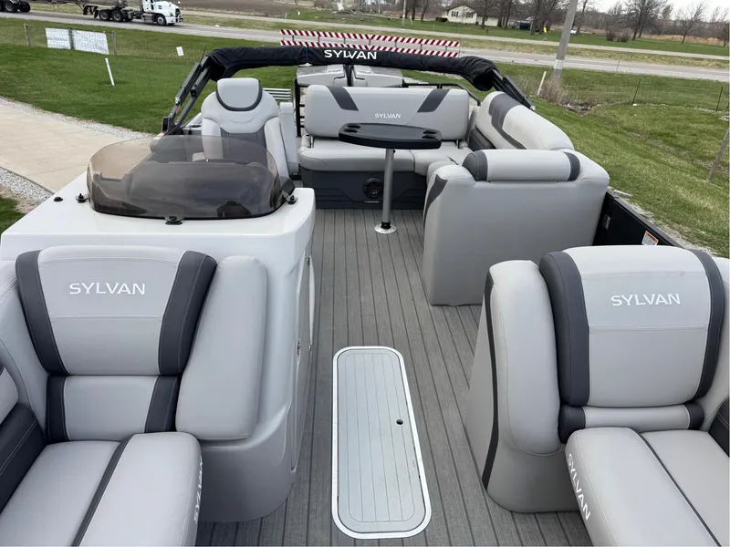 Slide: The Image of 2023 Sylvan L5 DLZ Bar pontoon boat with luxurious gray seating and spacious deck. - 7