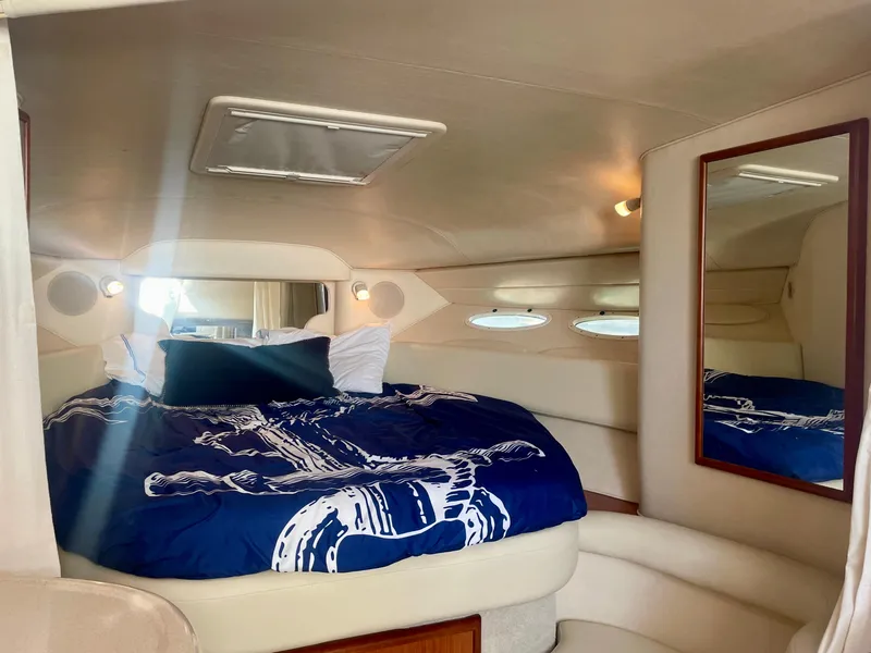 Slide: The Image of Interior cabin of 2001 Sea Ray 340 Sundancer with nautical bedding and mirror. - 21