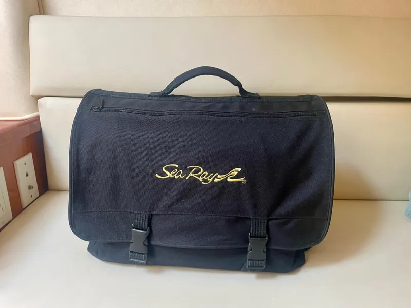Slide: The Image of Black Sea Ray bag on beige seat, associated with 2001 Sea Ray 340 Sundancer. - 32