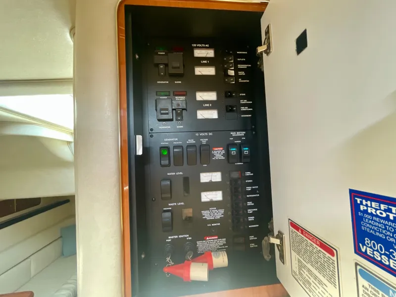 Slide: The Image of Electrical panel inside 2001 Sea Ray 340 Sundancer boat cabin. - 33