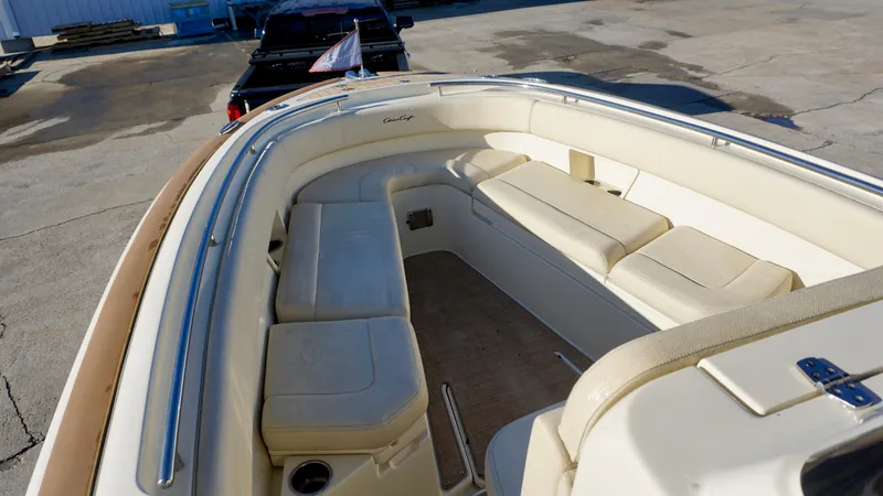 Slide: The Image of 2021 Chris-Craft Catalina 27 boat interior with beige seating and stainless steel railings. - 10