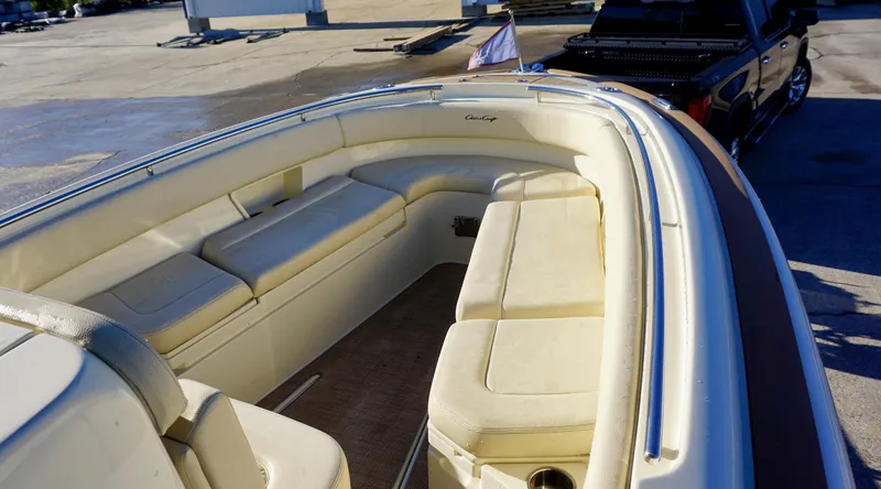Slide: The Image of 2021 Chris-Craft Catalina 27 boat interior with beige seating and sleek design. - 12
