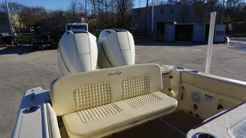Slide: The Image of 2021 Chris-Craft Catalina 27 boat with dual Mercury engines and cushioned seating. - 14