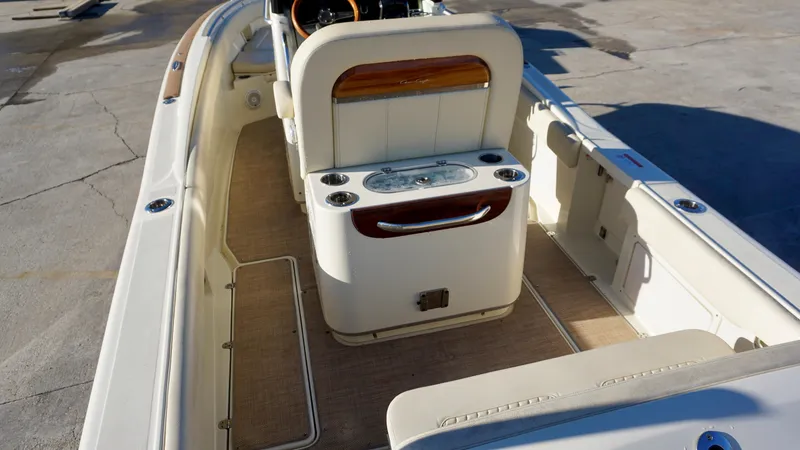 Slide: The Image of 2021 Chris-Craft Catalina 27 boat interior with seating and console. - 16