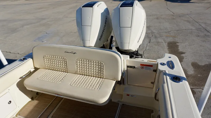 Slide: The Image of 2021 Chris-Craft Catalina 27 boat with dual engines and cushioned seating. - 21