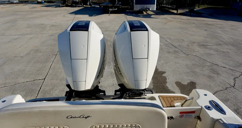 Slide: The Image of 2021 Chris-Craft Catalina 27 with dual outboard engines, rear view. - 23