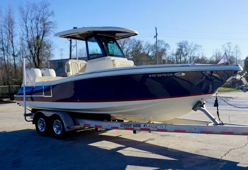 Slide: The Image of 2021 Chris-Craft Catalina 27 boat on trailer, parked outdoors. - 9