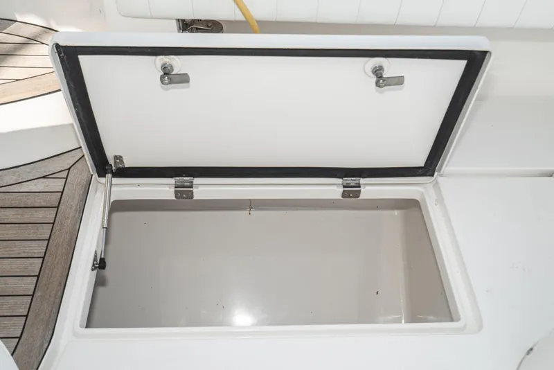 Slide: The Image of Open storage compartment on 2010 Intrepid 43 Sport Yacht deck. - 15
