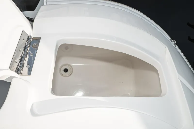 Slide: The Image of Open storage compartment on a 2010 Intrepid 43 Sport Yacht. - 18