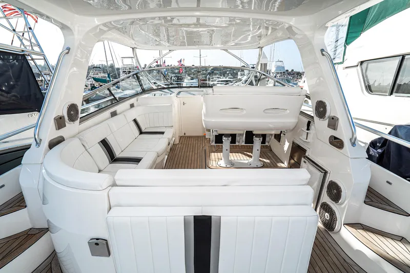Slide: The Image of Luxurious interior of 2010 Intrepid 43 Sport Yacht with white seating and wood flooring. - 20