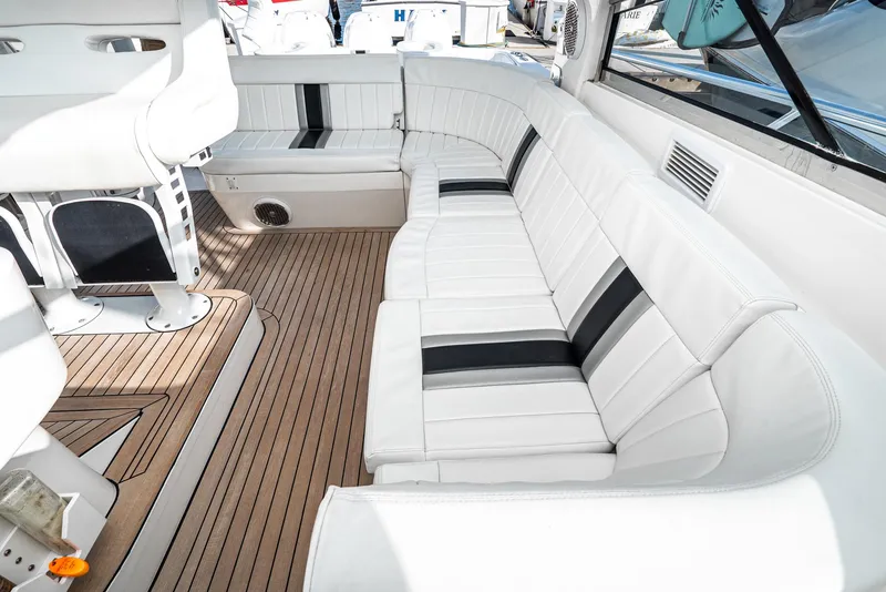 Slide: The Image of Luxurious seating area on 2010 Intrepid 43 Sport Yacht with white and black upholstery. - 21