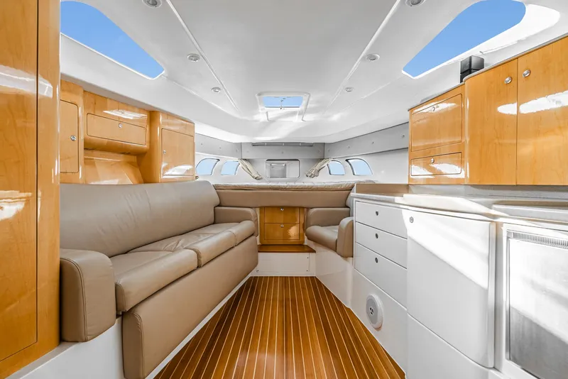 Slide: The Image of Luxurious interior of a 2010 Intrepid 43 Sport Yacht with leather seating and wood finishes. - 26