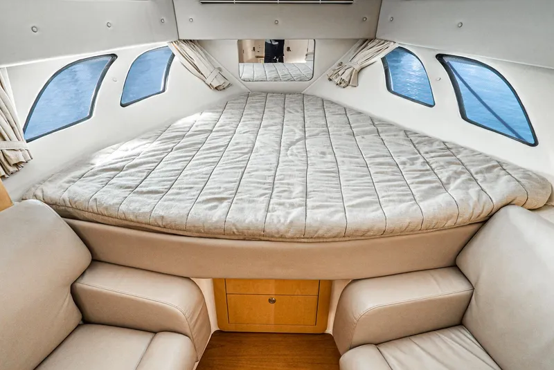 Slide: The Image of Interior cabin of 2010 Intrepid 43 Sport Yacht with bed and seating. - 27