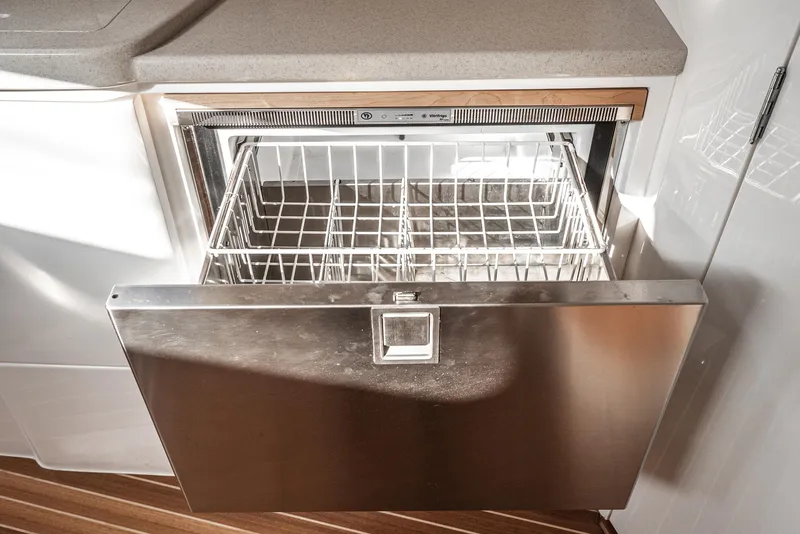 Slide: The Image of Stainless steel drawer dishwasher in 2010 Intrepid 43 Sport Yacht kitchen. - 30