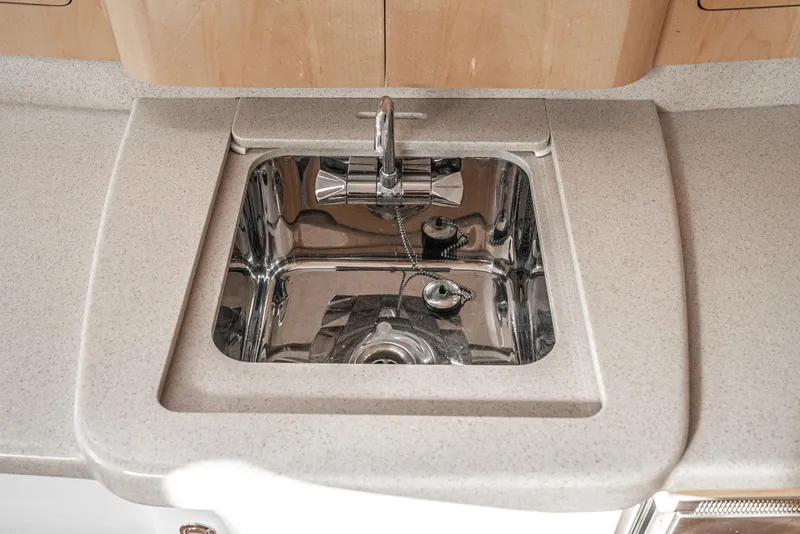 Slide: The Image of Stainless steel sink in 2010 Intrepid 43 Sport Yacht's modern kitchen area. - 32