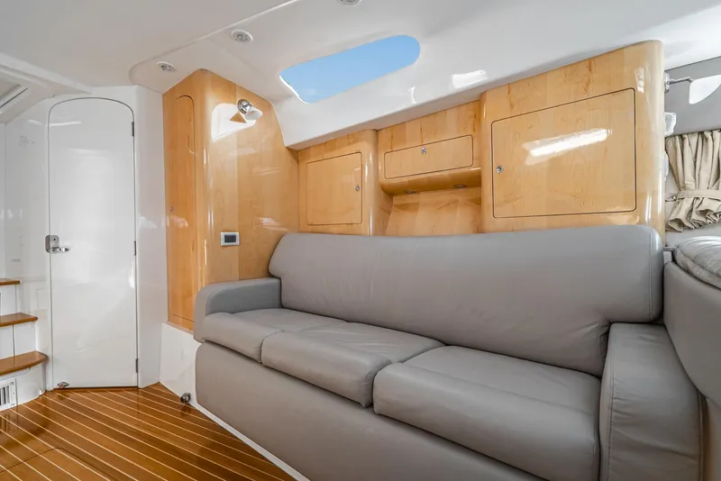 Slide: The Image of Interior of 2010 Intrepid 43 Sport Yacht with sleek wood finishes and comfortable seating. - 33