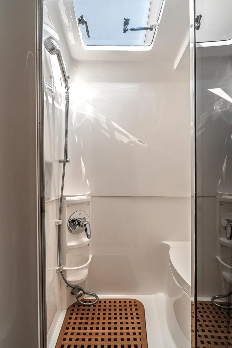 Slide: The Image of Shower area in 2010 Intrepid 43 Sport Yacht with skylight and wooden floor mat. - 35