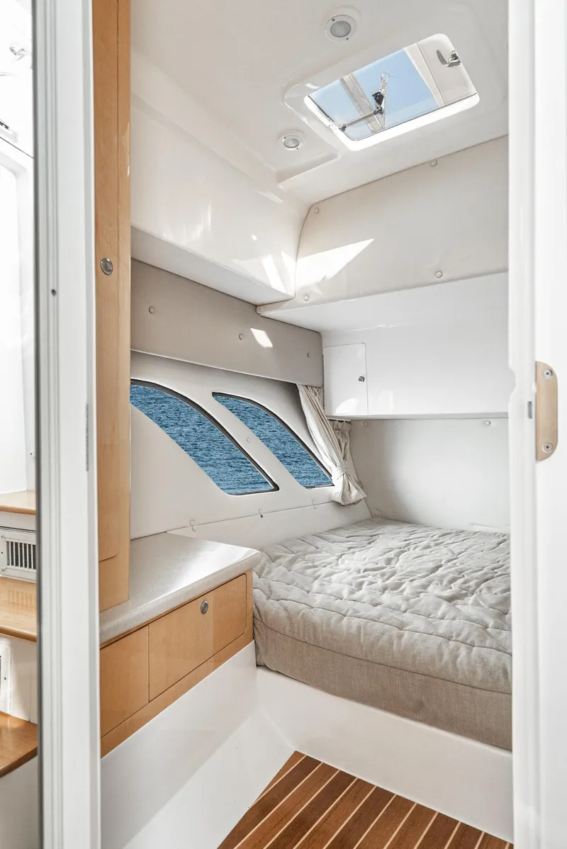 Slide: The Image of Interior cabin of 2010 Intrepid 43 Sport Yacht with bed and skylight. - 36
