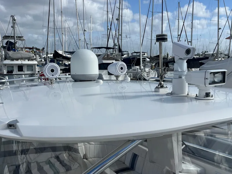 Slide: The Image of 2010 Intrepid 43 Sport Yacht with advanced navigation equipment, docked in a marina. - 39