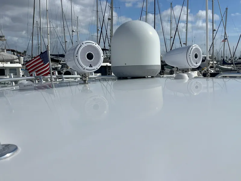 Slide: The Image of Rooftop of 2010 Intrepid 43 Sport Yacht with radar and speakers, docked in marina. - 40