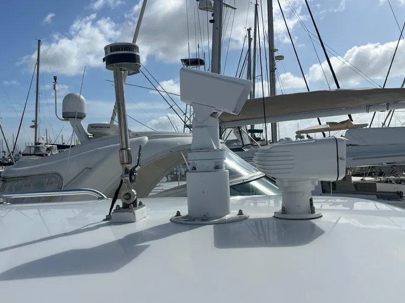 Slide: The Image of 2010 Intrepid 43 Sport Yacht with radar and navigation equipment on deck, docked at marina. - 41