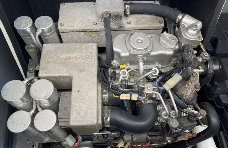 Slide: The Image of Engine of a 2010 Intrepid 43 Sport Yacht, showcasing mechanical components and hoses. - 44
