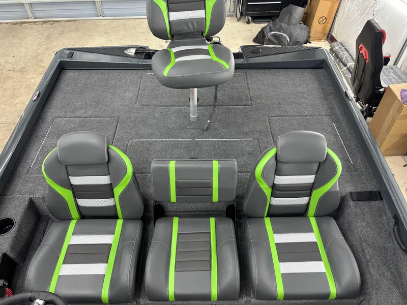 Slide: The Image of 2025 Ranger RT198P boat interior with gray and green seating, showcasing modern design and comfort. - 15