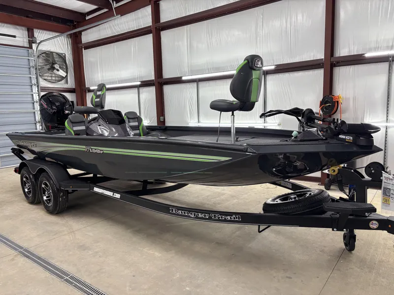 Slide: The Image of 2025 Ranger RT198P fishing boat in a garage, featuring sleek design and modern equipment. - 16