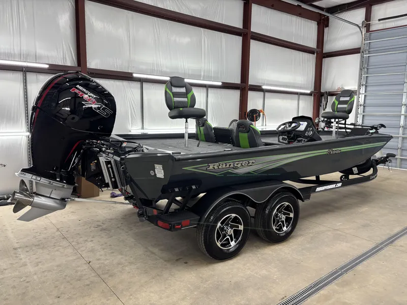 Slide: The Image of 2025 Ranger RT198P fishing boat with Mercury engine in a garage setting. - 3