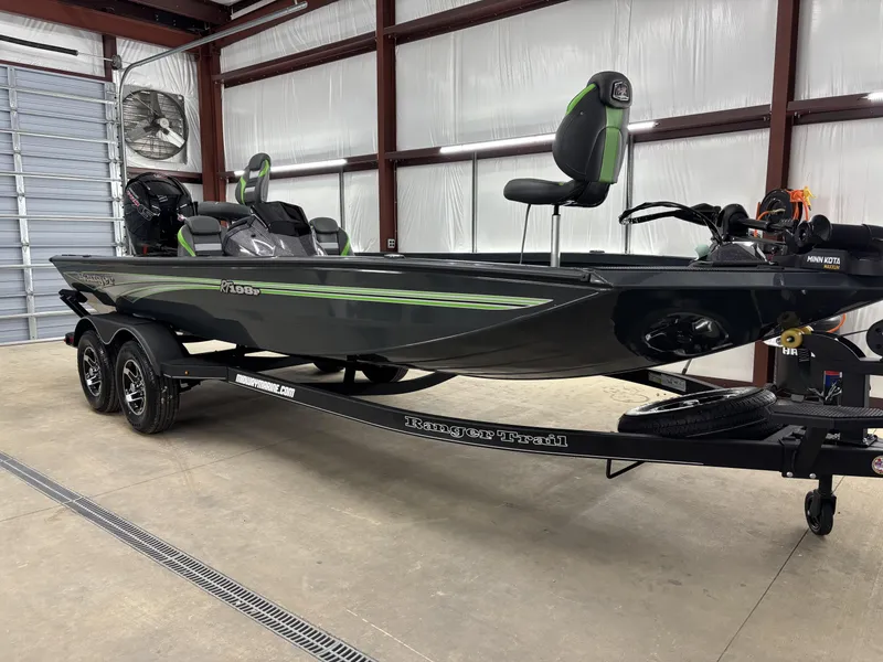 Slide: The Image of 2025 Ranger RT198P fishing boat in a garage, featuring sleek design and modern equipment. - 4