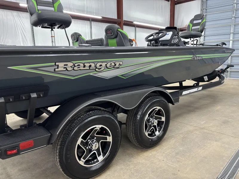 Slide: The Image of 2025 Ranger RT198P boat in a garage, featuring sleek design and modern seating. - 7