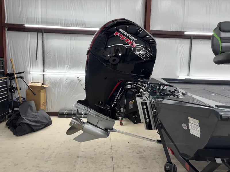 Slide: The Image of 2025 Ranger RT198P boat with Mercury Pro XS engine in a garage. - 8