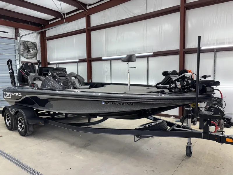 Slide: The Image of 2023 Nitro Z20 Pro bass boat in a garage, featuring sleek design and advanced equipment. - 12