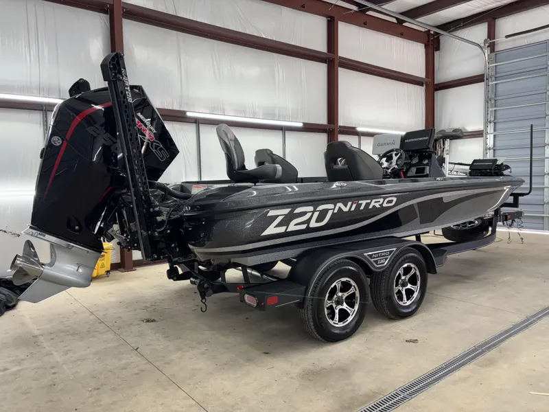 Slide: The Image of 2023 Nitro Z20 Pro boat in a garage, featuring sleek design and powerful engine. - 13