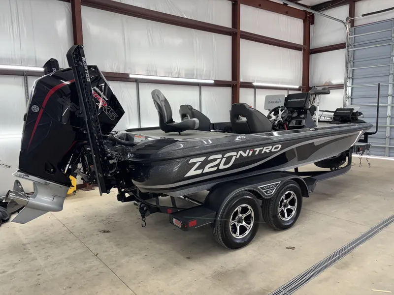 Slide: The Image of 2023 Nitro Z20 Pro boat in a garage, featuring sleek design and advanced equipment. - 14