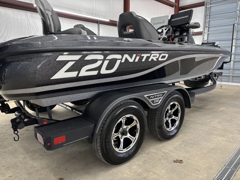 Slide: The Image of 2023 Nitro Z20 Pro boat on trailer in garage setting. - 15