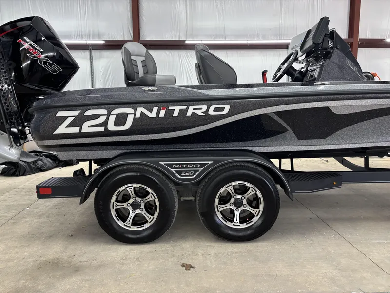 Slide: The Image of 2023 Nitro Z20 Pro boat on trailer in indoor setting. - 16