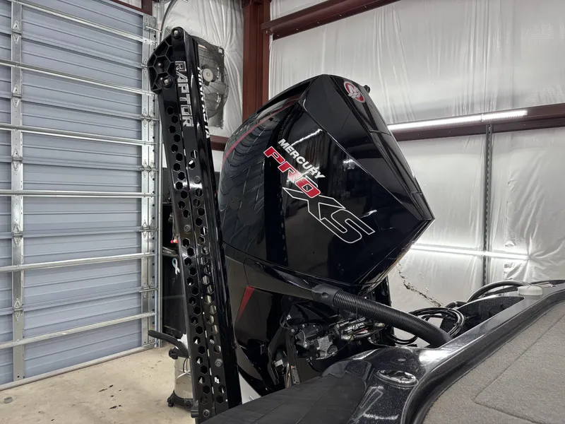 Slide: The Image of 2023 Nitro Z20 Pro boat with Mercury Pro XS engine in a garage. - 3