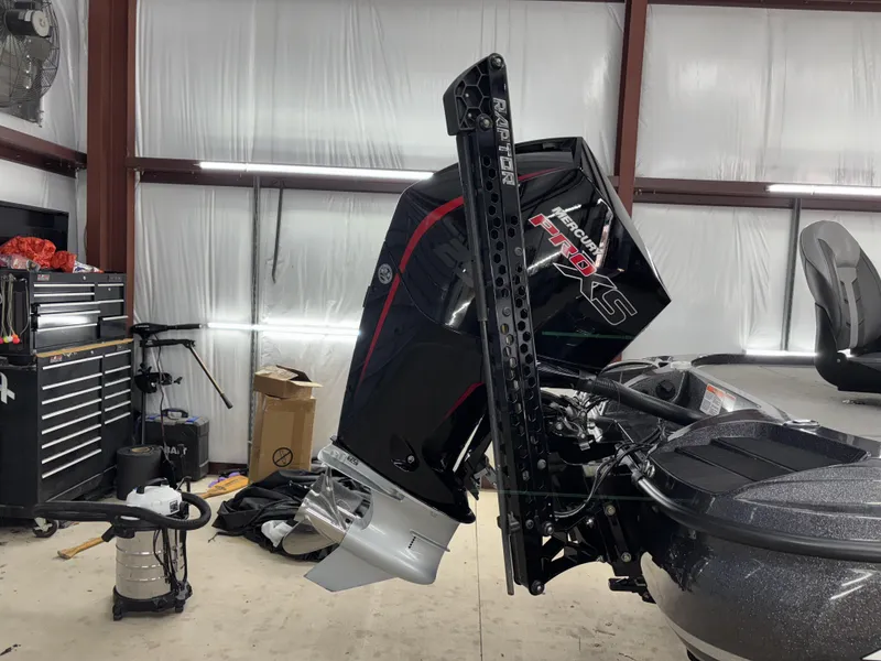 Slide: The Image of 2023 Nitro Z20 Pro boat with Mercury Pro XS engine in a garage setting. - 4