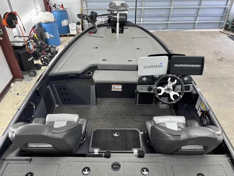 Slide: The Image of 2023 Nitro Z20 Pro boat interior with Garmin and Humminbird electronics in a garage setting. - 6