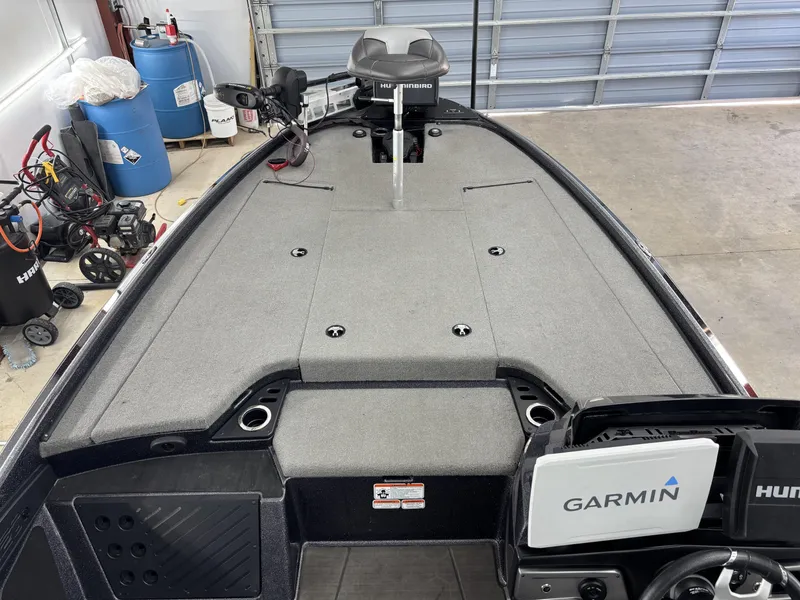 Slide: The Image of 2023 Nitro Z20 Pro boat interior with Garmin and Humminbird electronics in a garage setting. - 7