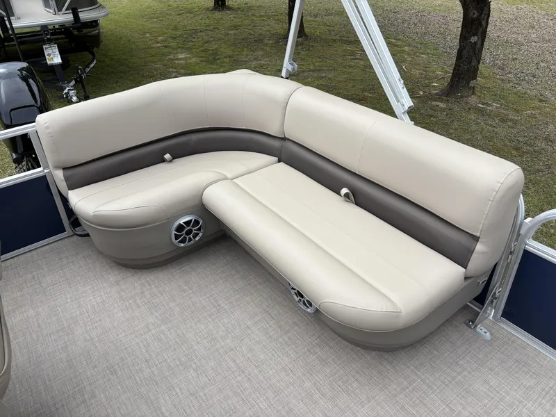 Slide: The Image of 2025 Sun Tracker Bass Buggy 16 XL Select pontoon boat seating, beige and brown upholstery. - 11